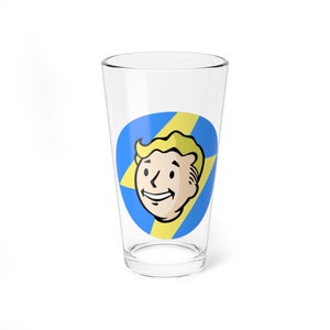 May include: A clear glass pint glass with a blue and yellow graphic of a cartoon character with blonde hair and a lightning bolt. The character is smiling.