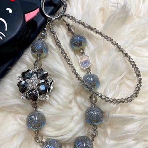 Stardust Noir Phone Charm: Galaxy Beads, Smoky Crystals & Floral Medallion