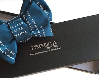 Your bow tie in a gift box! Packaging upgrade. Black paperboard bowtie box, embossed Cyberoptix Tie Lab box top.