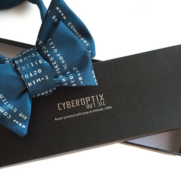 Your bow tie in a gift box! Packaging upgrade. Black paperboard bowtie box, embossed Cyberoptix Tie Lab box top.