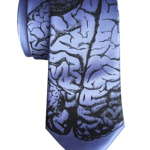 May include: A blue silk tie with a black and white anatomical brain print.