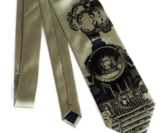 May include: A green silk tie with a black and white illustration of a steam locomotive with the number 1873 on the front.