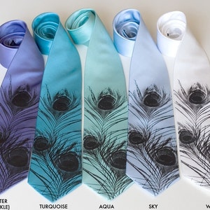 May include: Five silk ties with a peacock feather design. The ties are in shades of blue, turquoise, aqua, sky blue, and white.