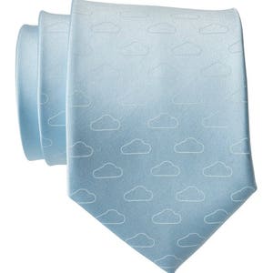 May include: A light blue tie with a white cloud pattern.