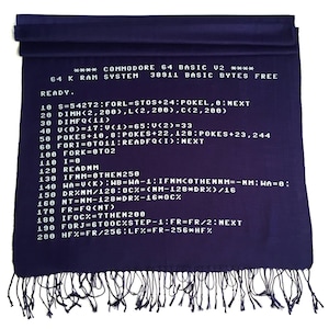 May include: A purple scarf with white text that reads "**** COMMODORE 64 BASIC U2 **** 64 K RAM SYSTEM 38911 BASIC BYTES FREE READY." and then a series of code lines.