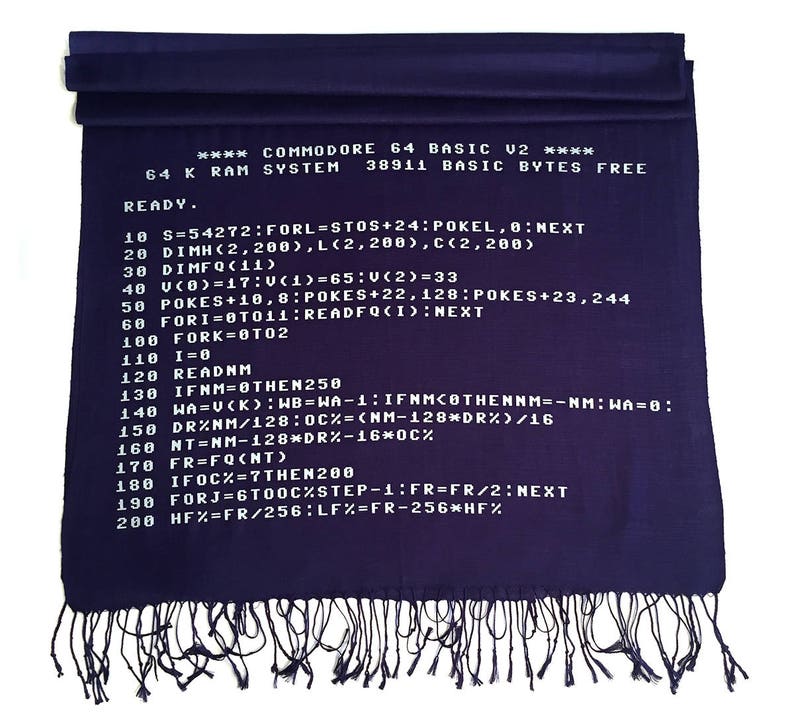 May include: A purple scarf with white text that reads "**** COMMODORE 64 BASIC U2 **** 64 K RAM SYSTEM 38911 BASIC BYTES FREE READY." and then a series of code lines.