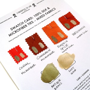 May include: Swatch card showing different colors of silk and microfiber ties. The colors are coral, cinnamon, pumpkin spice, antique brass, soft gold, and persimmon. The card includes the text "Swatch Card: 100% Silk & Microfiber Ties - Mixed Fabrics".