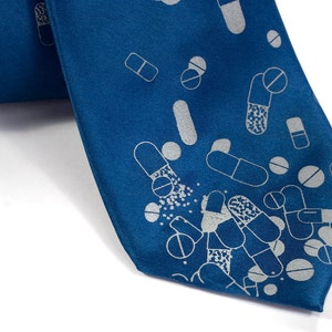 Pill tie, men's silk necktie. Capsule & tablet silkscreen design. Dove gray print. "Pill Spill." Perfect for doctors and pharmacists.