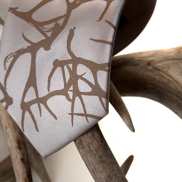 Stag Party men's necktie. Silkscreen deer antler pattern microfiber tie. Tan print. Standard or narrow.