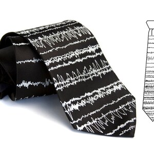May include: A black tie with a white EKG pattern. The tie is made of silk and has a classic design.