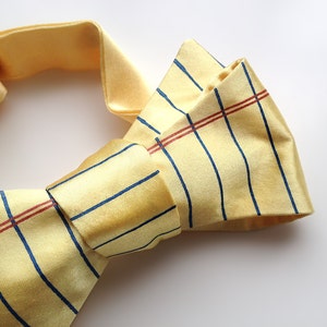 Legal Pad bow tie. Yellow lined paper bow tie. Perfect lawyer, legal defense, judge, law student or attorney gift. By Cyberoptix Tie Lab.