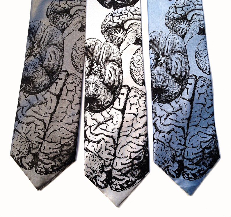 May include: Three silk ties with a gray background and a black and white anatomical brain print.