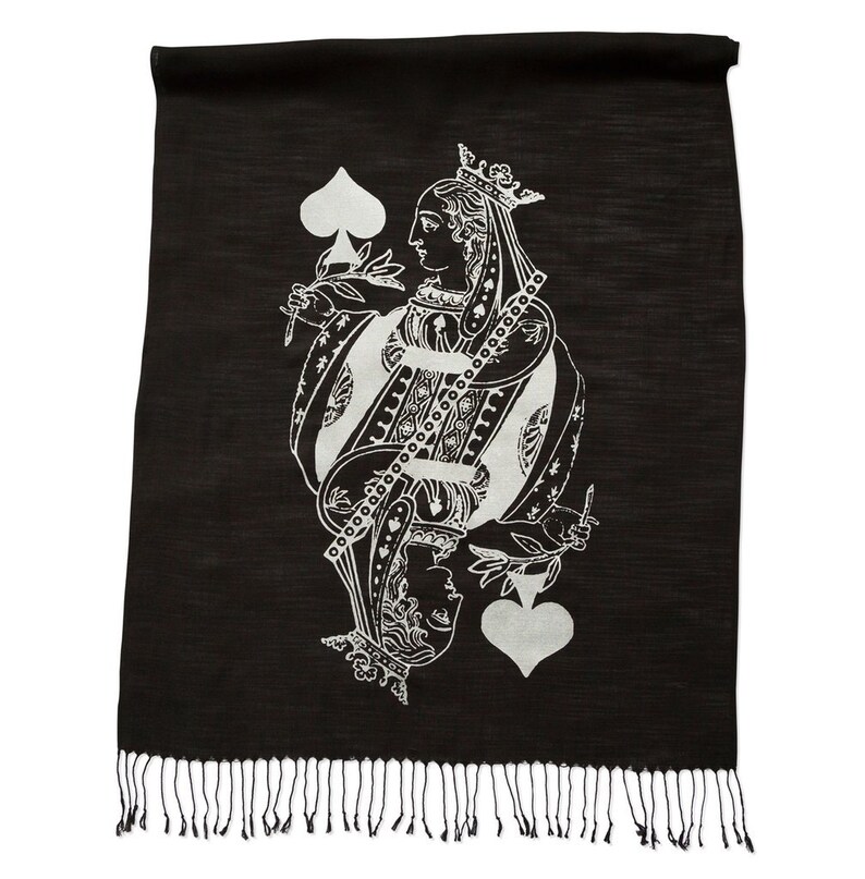 May include: Black silk scarf with a white print of the Queen of Spades playing card. The scarf has a fringe border.