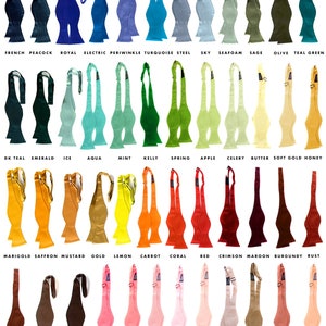 May include: A chart of 36 bow tie color samples, each with a name label. The bow ties are arranged in rows of 8, with the names of the colors listed below each bow tie. The bow ties are all made of a silky microfiber fabric and are available in a variety of colors, including black, navy, charcoal, gunmetal, silver, aluminum, champagne, cream, platinum, white, French peacock, royal, electric, periwinkle, turquoise, steel, sky, seafoam, sage, olive, teal, green, dark teal, emerald, ice, aqua, mint, kelly, spring, apple, celery, butter, soft gold, honey, marigold, saffron, mustard, gold, lemon, carrot, coral, red, crimson, maroon, burgundy, rust, cinnamon, milk chocolate, dark brown, hot pink, honey suckle, pink, light pink, ballet, peach, pale copper, dark salmon, salmon, spiced wine, eggplant, deep purple, purple, lavender, orchid, plum, violet, raspberry, fuchsia, and rose. The bow ties are 14.25 to 19 inches in collar size, adjustable, and have a thistle shape. They are made of silky microfiber and are vegan friendly.