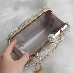 opened pearl beaded bridal clutch