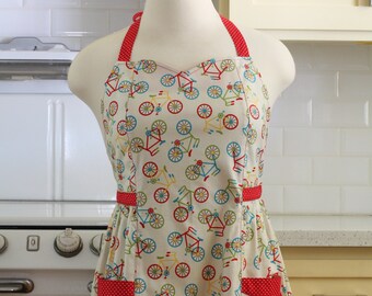 Betty Plus Size Apron - Bicycles on Cream with Red