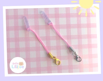 Dust plug and string for charms