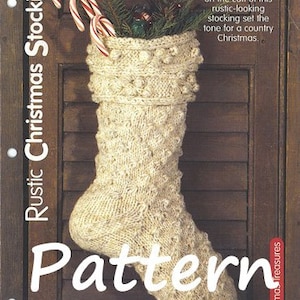 May include: A knitted Christmas stocking with a textured pattern and a white background. The stocking is filled with candy canes and has a rustic look. The text "Rustic Christmas Stocking" is written vertically on the left side of the image. The text "Pattern" is written in large white letters across the bottom of the image. The text "Christmas Treasures" is written vertically on the right side of the image.