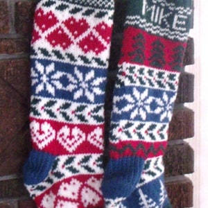May include: Two knitted Christmas stockings with green, red, white, and blue patterns. The stockings have the names "Jess" and "Mike" embroidered on them.