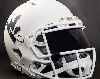 May include: A white football helmet with a dark visor and a white facemask. The helmet features a navy blue "WV" logo on the side and the text "Big 12" in red. The helmet is designed for protection during gameplay.