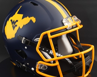 May include: A navy blue football helmet with a yellow stripe and face mask. The helmet features a yellow outline of West Virginia with the letters "WV" inside. The helmet is a Riddell brand.