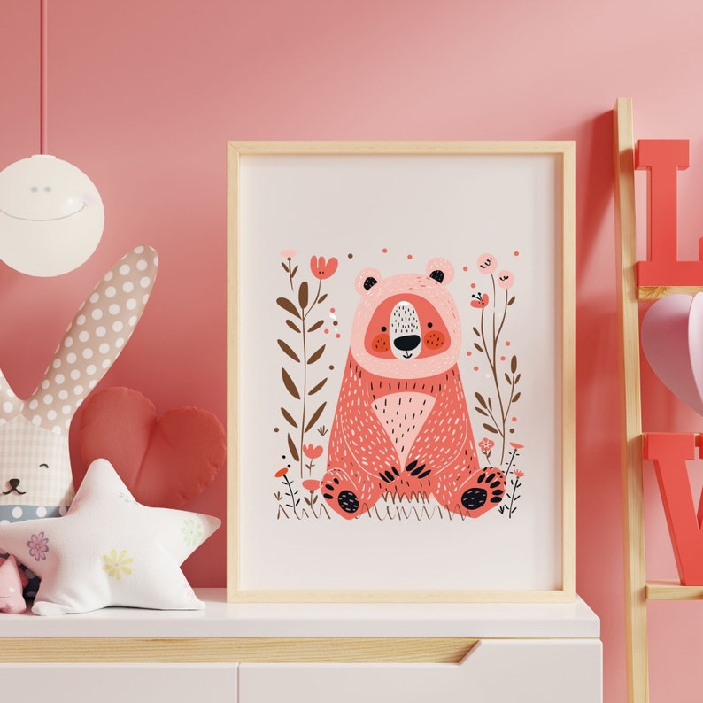 May include: A pink bear with a white face and black eyes sits in a field of pink flowers. The bear is surrounded by green leaves and brown branches. The background is a light pink.