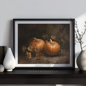 May include: A painting of two orange pumpkins with green leaves on a dark background.