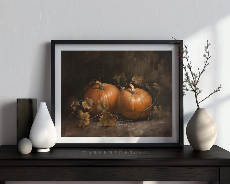 May include: A painting of two orange pumpkins with green leaves on a dark background.