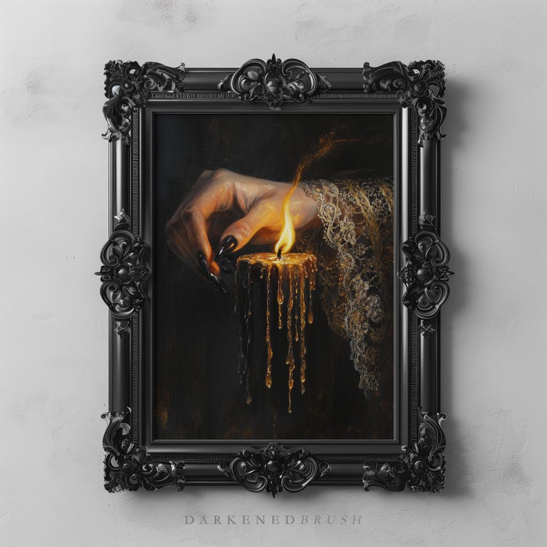 May include: A framed painting depicts a hand with long, black nails lighting a candle. The candle is dripping with wax, and the flame is bright. The frame is black and ornate, with decorative details. The painting has a dark, gothic aesthetic.