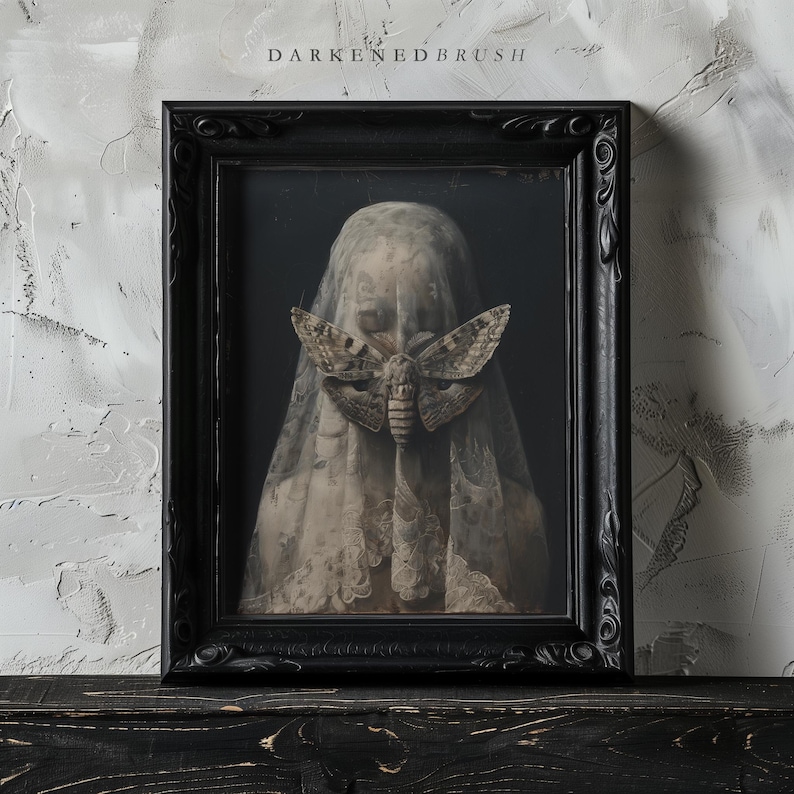 May include: A black framed portrait of a person with a veil covering their face. A large moth is visible through the veil, covering the person's eyes.