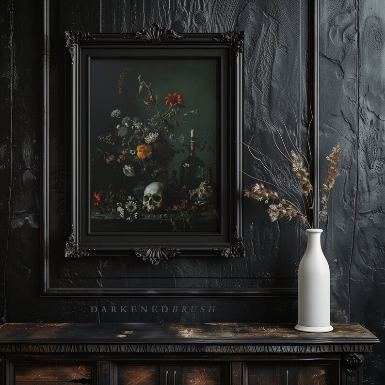 May include: An oil painting in a black frame depicting a still life with flowers, a skull, and a bottle. The painting is hanging on a dark wood wall with a white vase containing dried flowers on a black table.