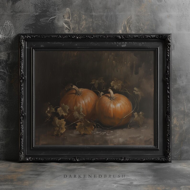 May include: A painting of two orange pumpkins with green leaves in a dark brown frame.