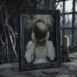 May include: A framed painting of a woman with a mirror covering her face. The mirror is round and gold with a dark forest scene reflected in it. The woman is wearing a white dress with a pearl necklace. The frame is black and ornate.