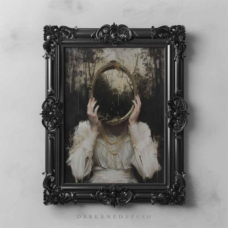 May include: A woman in a white dress holds a large, ornate, gold-framed mirror in front of her face. The mirror reflects a dark, wooded scene. The woman is framed in a black, ornate picture frame.