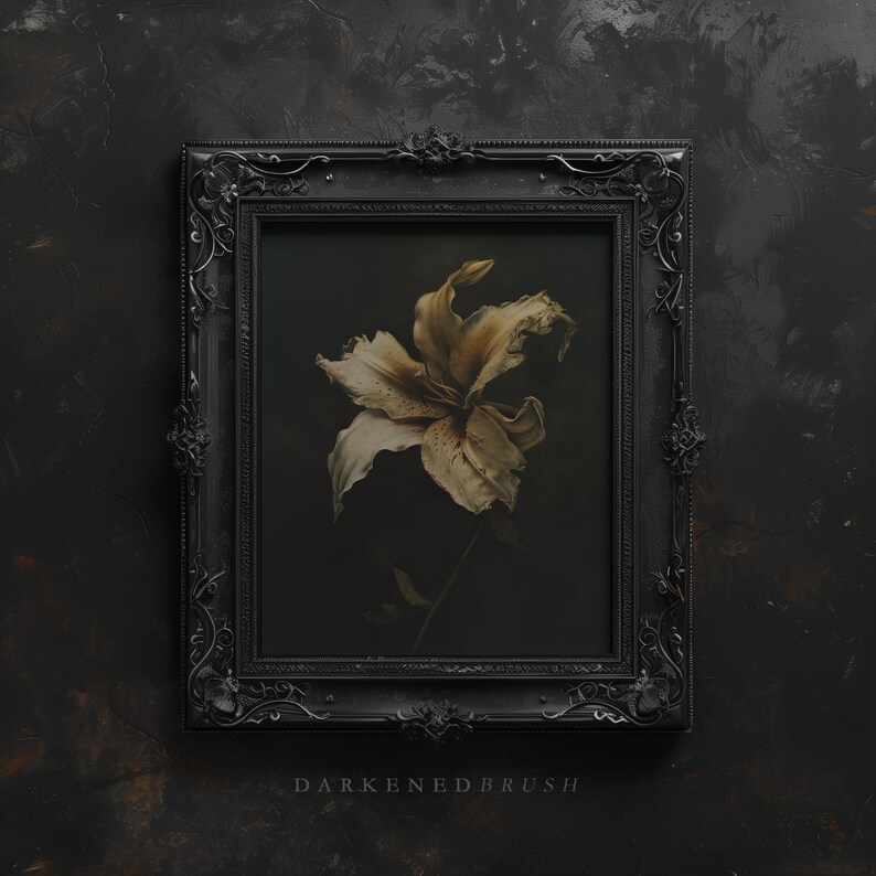 May include: A black ornate picture frame with a faded white lily flower inside. The background is a dark gray textured surface. The text "DARKENED BRUSH" is below the frame.