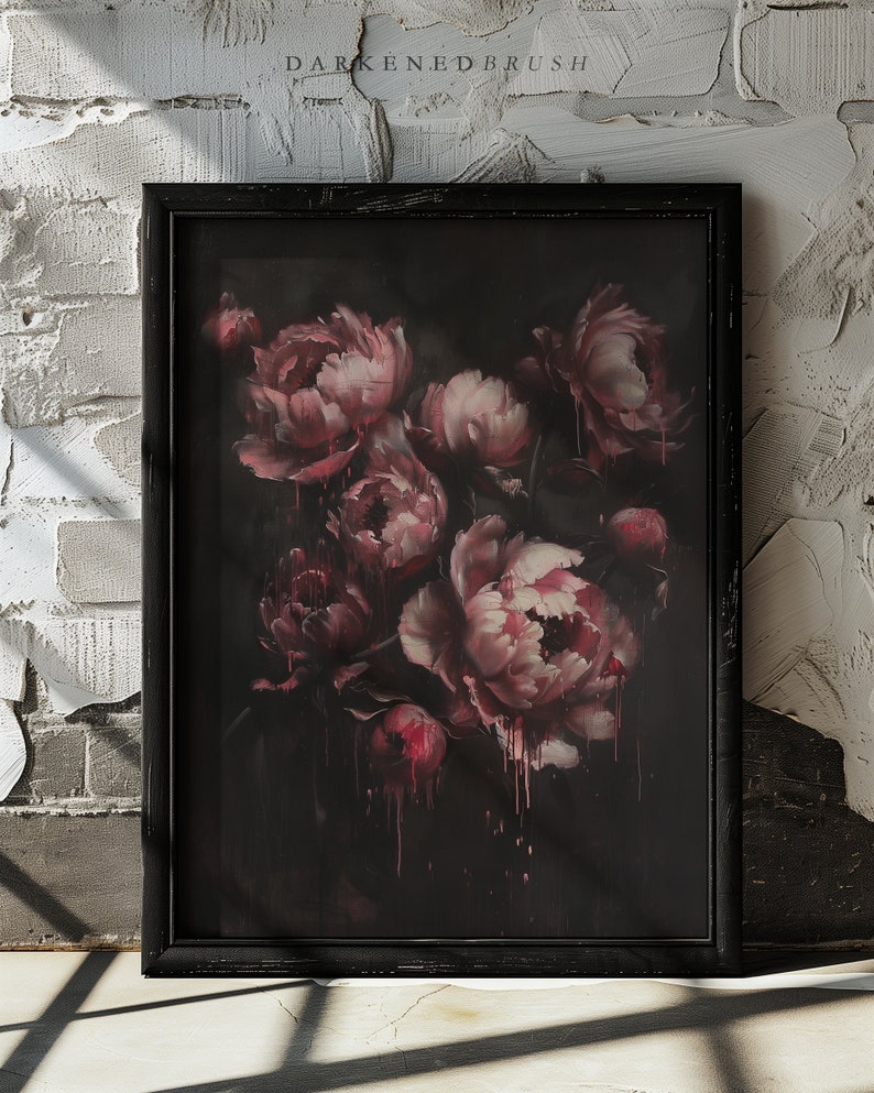 May include: A framed painting of a bouquet of pink peonies with dark red accents, painted in a dark, moody style. The painting is framed in a black frame.