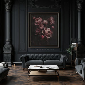 May include: A dark, moody living room with black walls, a black velvet sofa, and a black velvet armchair. A large framed painting of pink flowers hangs on the wall. The room is decorated with gold accents and a marble coffee table.