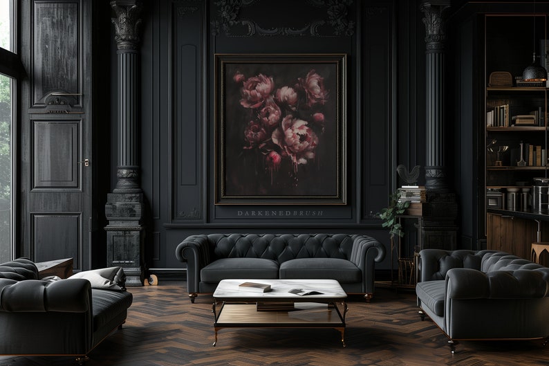 May include: A dark, moody living room with black walls, a black velvet sofa, and a black velvet armchair. A large framed painting of pink flowers hangs on the wall. The room is decorated with gold accents and a marble coffee table.