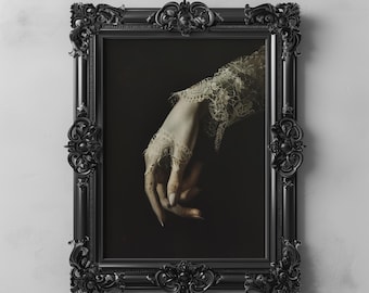 May include: A black ornate frame with a dark background and a hand wearing a lace glove reaching out from the frame.