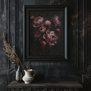 May include: A framed print of a dark floral still life featuring pink peonies with dripping paint. The print is framed in black and has the text "Darkened Brush" below the image.