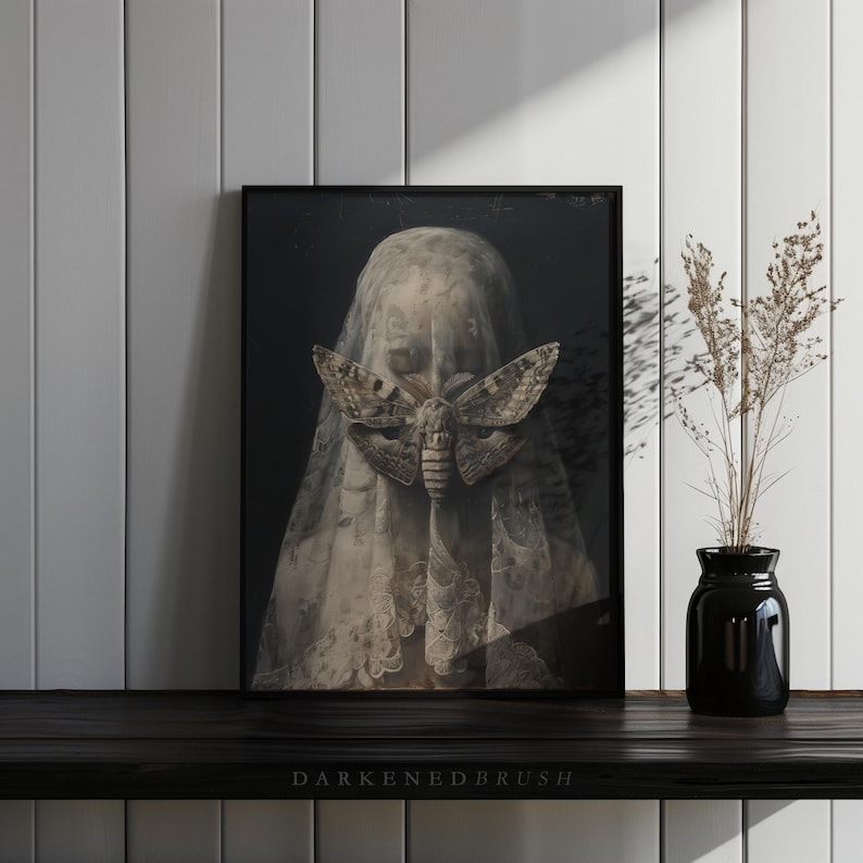 May include: A black and white photo of a person wearing a veil with a large moth covering their face. The moth is a death's-head hawkmoth, a species known for its skull-like markings on its thorax.