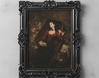 May include: A woman in a red dress lies in a coffin, surrounded by flowers and foliage. The coffin is open and the woman's eyes are closed. The image is framed in a black ornate frame.