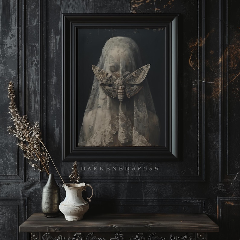 May include: A framed painting of a woman's face partially obscured by a white veil with a large moth resting on it. The painting is set against a dark background and the text "DARKENED BRUSH" is printed below the frame.