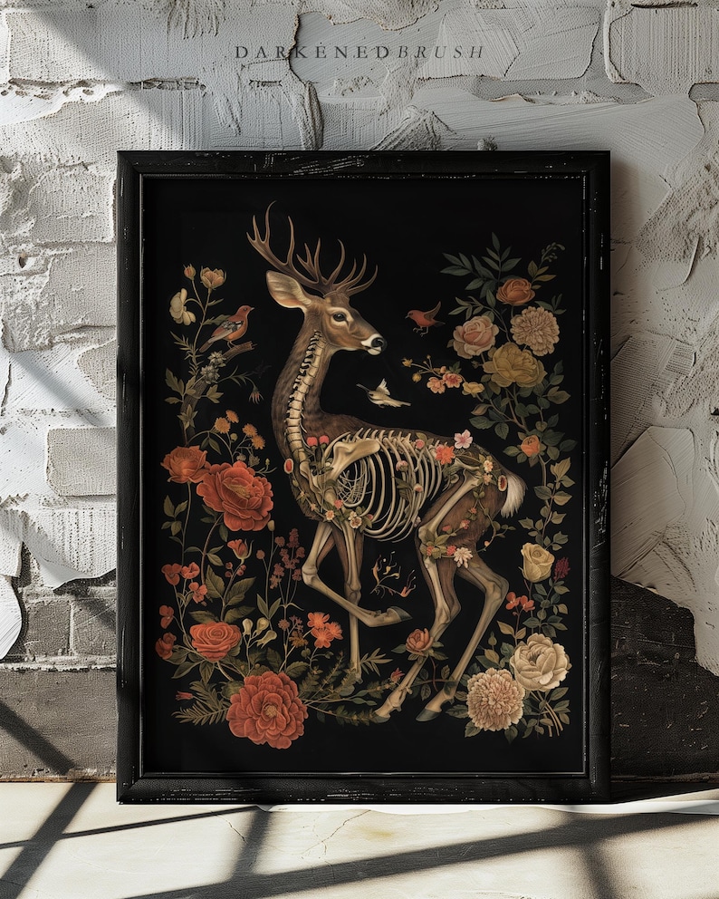 May include: A skeletal deer with antlers is surrounded by a vibrant floral arrangement. The deer is depicted in a standing pose, with its legs and ribs visible. The flowers are a mix of red, white, and yellow, and they are arranged in a circular pattern around the deer. The background is black.