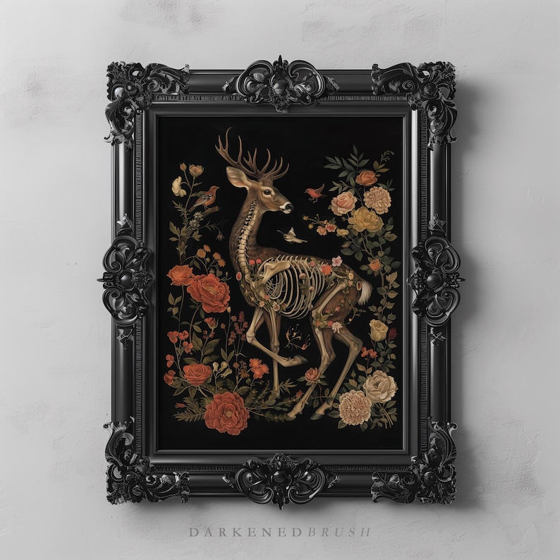 May include: A framed art print depicting a skeletal deer standing in a field of flowers. The deer is rendered in a realistic style with intricate detail. The flowers are a variety of colours, including red, yellow, and white. The print is set against a black background and framed in a black ornate frame.