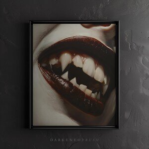 May include: Close-up of a mouth with dark red lipstick and sharp, pointed teeth. The teeth are bared in a menacing grin.