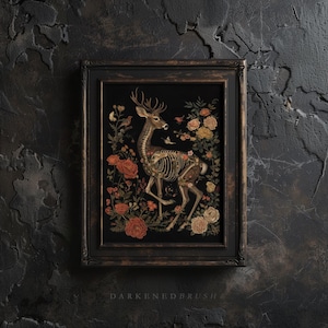 May include: A framed art print depicting a detailed illustration of a deer skeleton surrounded by flowers and birds. The background is black, and the frame is dark brown with a gold trim.