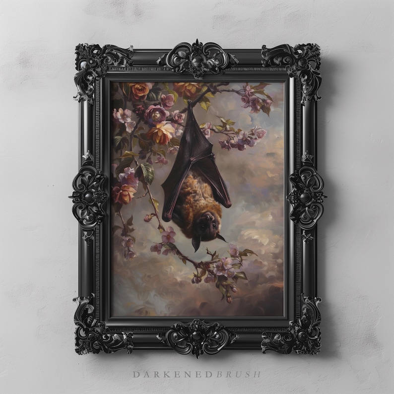 May include: A framed painting of a brown bat hanging upside down from a branch of a flowering tree. The bat is surrounded by pink and white blossoms. The painting is in a black ornate frame.
