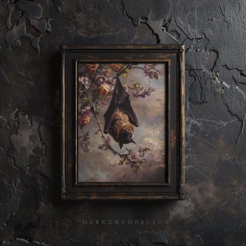 May include: A framed painting depicting a brown bat hanging upside down from a branch of a flowering tree. The bat is in focus, with the background blurred. The painting is set in a dark brown frame.