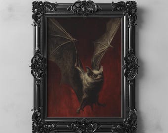 May include: A framed print of a bat with spread wings, set against a red backdrop. The bat is rendered in grey and brown tones, with detailed wing textures. The ornate black frame enhances the gothic style. The text "DARKENDEDBRUSH" is at the bottom.